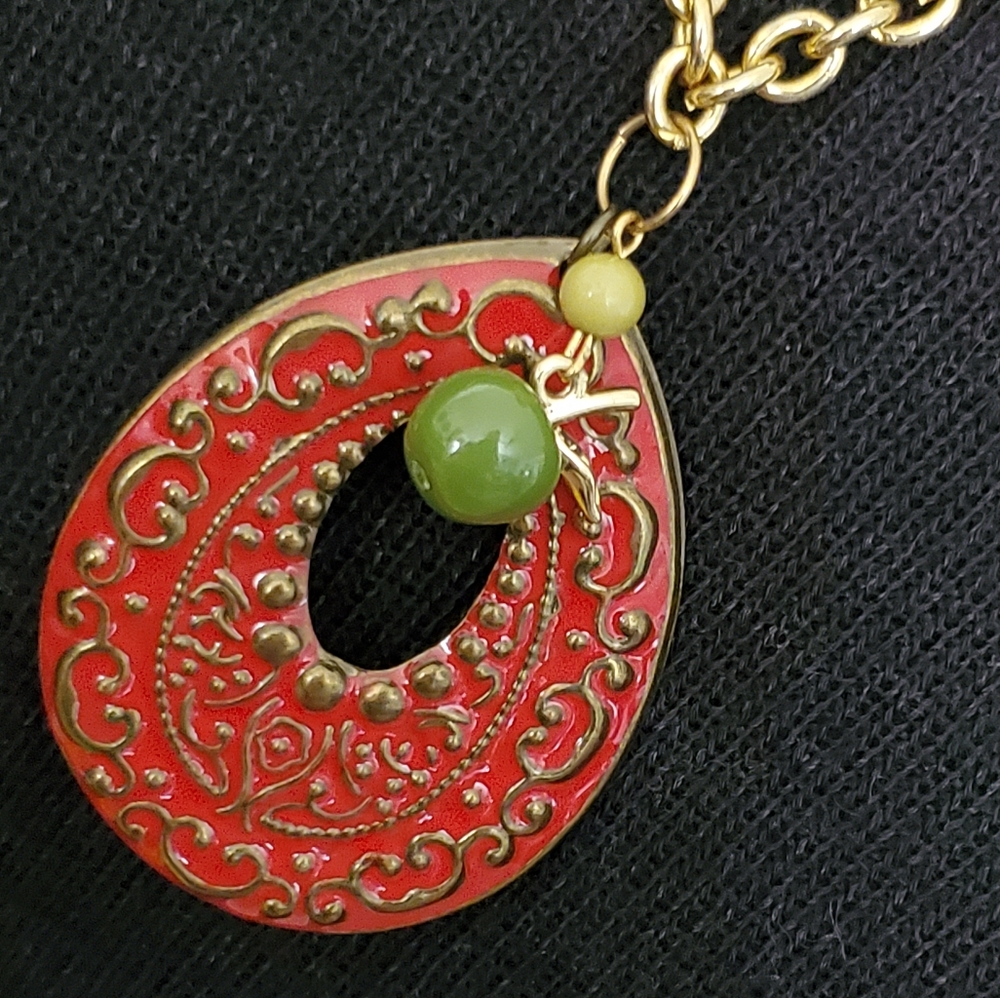 Vintage goldtone necklace with red teardrop pendant and green apple charm